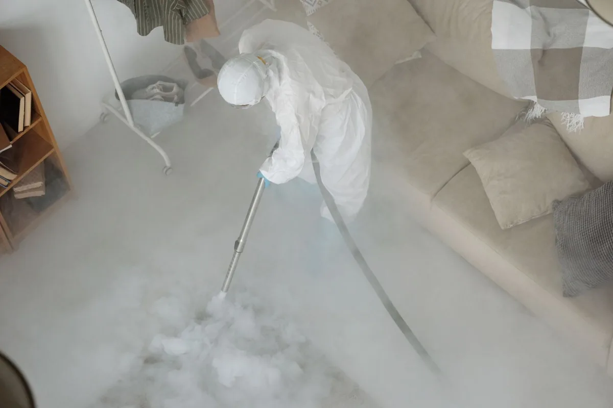 Biohazard cleanup technician in protective equipment, Lake Worth Beach, FL